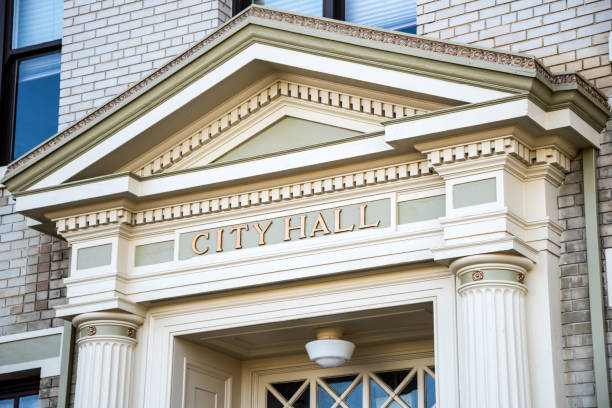 White Brick building, peaked entry way reading City Hall